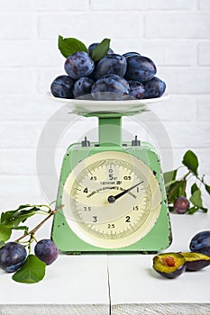 Plum fruit on old vintage scale 1960. One division of 20 grams.