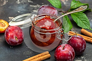 Plum jam nd fresh plums on a wooden background. banner, menu, recipe place for text