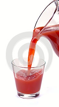 Plum juice is poured from a jug