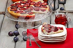 Plum pie in autumn party setting