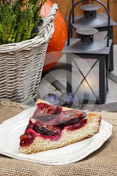 Plum pie in autumn party setting