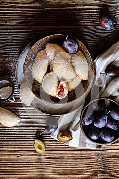 Plum pocket pies studded with powdered sugar