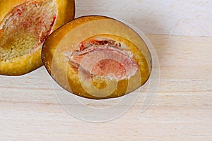 Plum with a slice and leaf