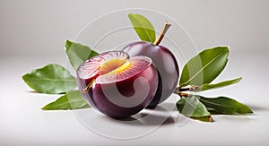 Plum with a slice and leaf