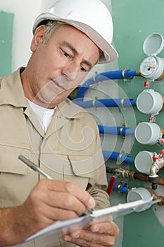 plumber checking water pipes