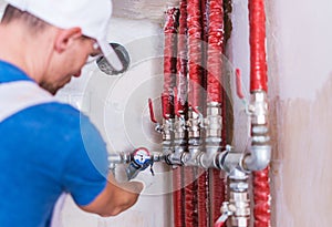 Plumber Checking on Water Supply