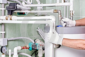 Plumber doing maintenance jobs for water and heating systems