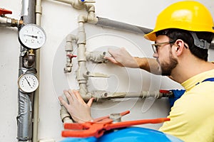 Plumber doing maintenance jobs for water and heating systems