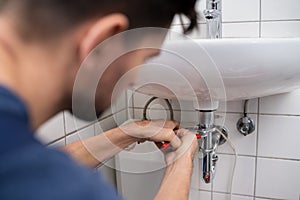 Plumber Fitting Sink Pipe