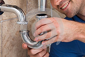 Plumber Fitting Sink Pipe