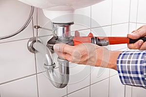 Plumber fitting sink pipe photo