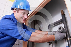 Plumber fitting water pipes photo