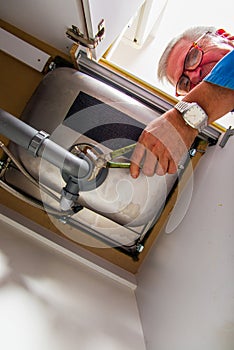 Plumber fixing the basin
