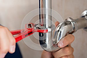 Plumber Fixing Pipe photo