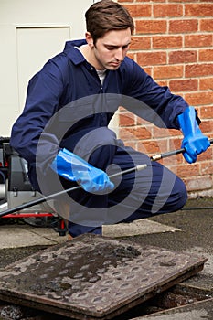 Plumber Fixing Problem With Drains
