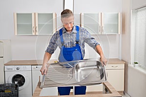 Plumber Fixing Sink