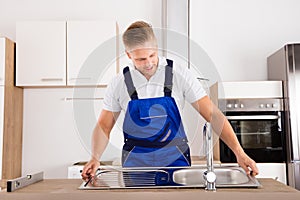 Plumber Fixing Stainless Steel Sink