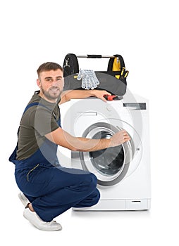 Plumber fixing washing machine