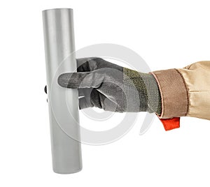 Plumber hand in black protective glove and brown uniform holding grey plastic sewer pipe isolated on white background