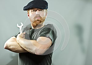 Plumber in hat with red beard