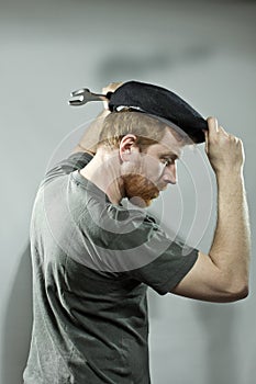 Plumber in hat with red beard