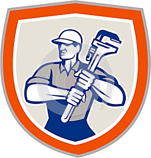 Plumber Holding Giant Monkey Wrench Shield