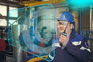 Plumber inspects piping for heat installation;The mechanic - the repairman tightens bolts on a flanged connection of pipeline