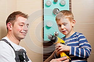 Plumber installing a mixer tap in a bathroom
