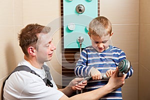 Plumber installing a mixer tap in a bathroom