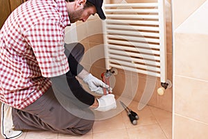 Plumber installing a thermostatic valve