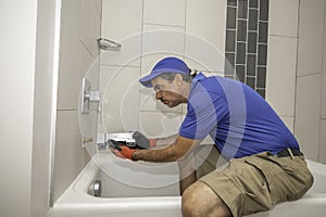 Plumber installing tub spout