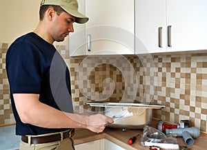 Plumber read instruction before installation sink in the kitchen