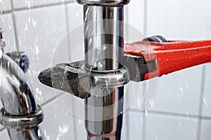 Plumber Repairing Sink Pipe Leakage