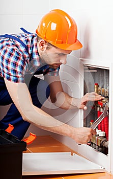 Plumber repairing a water tubing