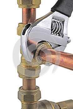 Plumber`s wrench tightening up copper 15mm pipework