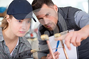 plumber teachning apprentice how to cut copper pipe