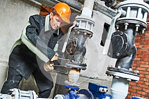 Plumber technician works with water pump