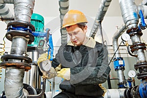 Plumber technician works with water pump