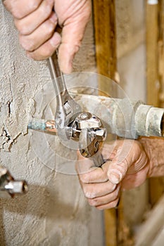 Plumber Tightens Valve