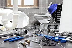 plumber tools and equipment in a bathroom, plumbing repair service, assemble and install concept