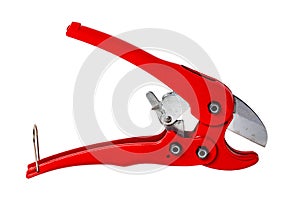 Plumber tools isolated. Closeup of a red PVC pipe cutter for cutting PE pressure pipe or water pipe isolated on a white background