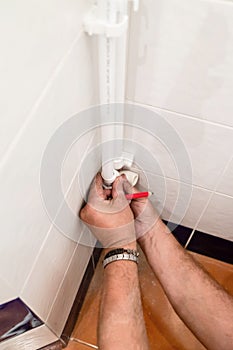 plumber tries elbow on polypropylene pipe