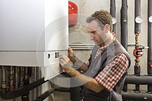 Plumber who carries out the maintenance of a condensing boiler