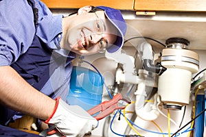 Plumber at work photo