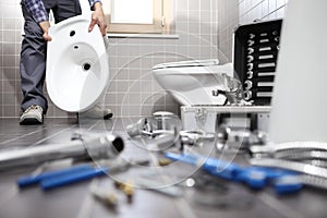 Plumber at work in a bathroom, plumbing repair service, assemble