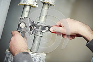 Plumber work. hand with wrench