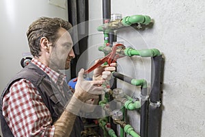 plumber at work installing a water meter