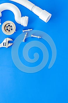 Plumber work with instruments, tools and gear on blue background top view mock up