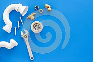 Plumber work with instruments, tools and gear on blue background top view mockup