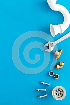 Plumber work with instruments, tools and gear on blue background top view mockup